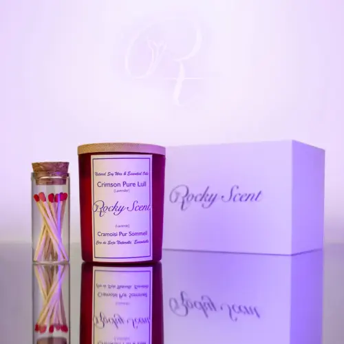 Crimson matte lavender soy candle from Rocky Scent’s Lull Essence line, paired with a match jar and white box.